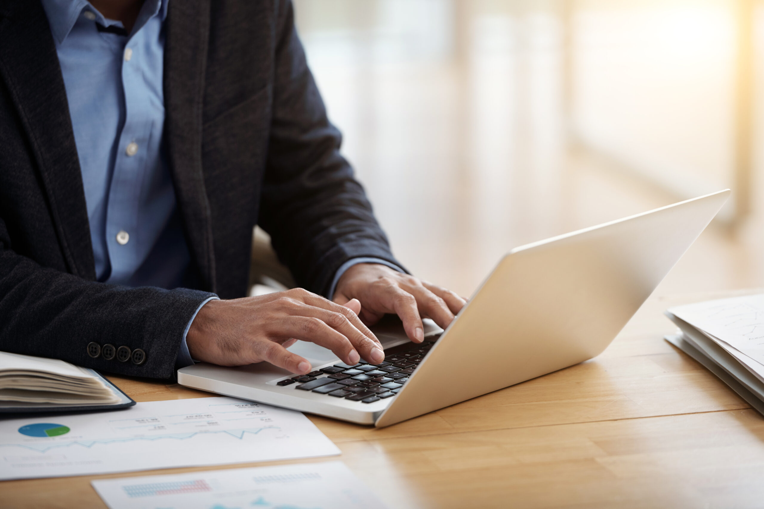 Hands of business executive answering e-mails from his business partners